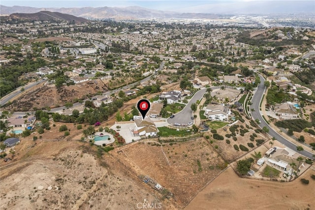 birds eye view of property featuring a mountain view and a residential view