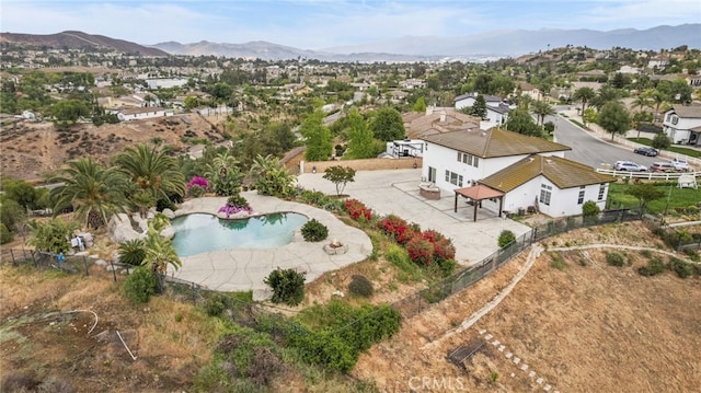 drone / aerial view featuring a mountain view and a residential view