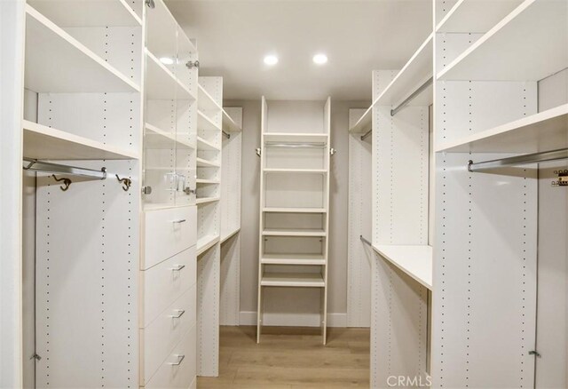 spacious closet with light wood-type flooring
