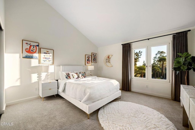 bedroom featuring high vaulted ceiling, light carpet, and baseboards