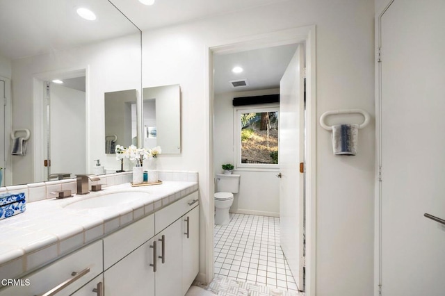 bathroom with visible vents, tile patterned flooring, vanity, toilet, and recessed lighting
