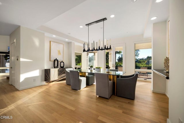 dining area with light wood-type flooring, recessed lighting, and baseboards