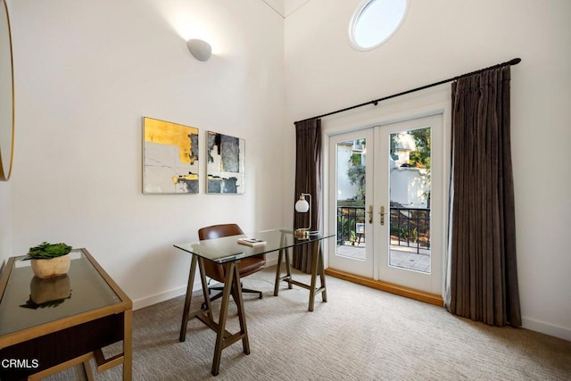 office space with carpet floors, baseboards, and french doors