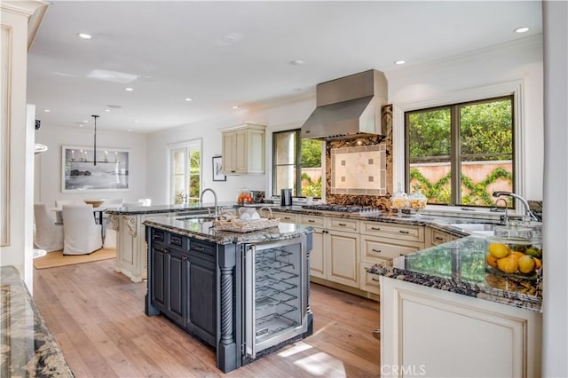2008 Via Visalia, Palos Verdes Estates, CA 90274 - kitchen with cream cabinets, wall chimney range hood, plenty of natural light, crown molding, and recessed lighting