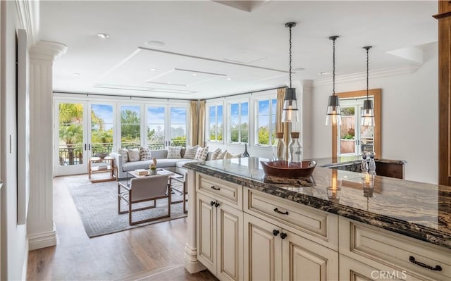 2008 Via Visalia, Palos Verdes Estates, CA 90274 - kitchen featuring cream cabinetry, wood finished floors, dark stone counters, ornate columns, and crown molding