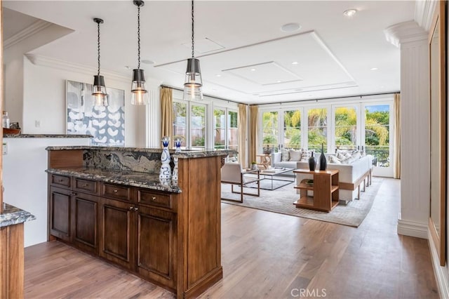 2008 Via Visalia, Palos Verdes Estates, CA 90274 - kitchen with dark stone counters, light wood-style floors, open floor plan, pendant lighting, and crown molding