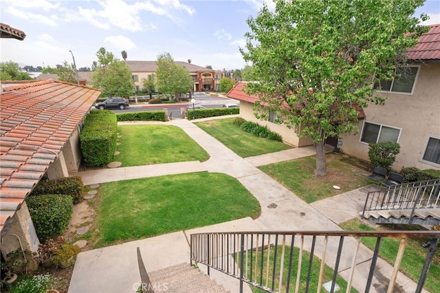 view of community featuring a yard
