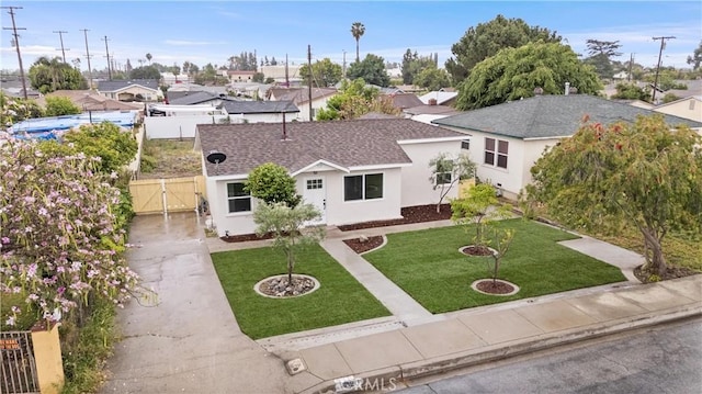 920 W Hollyvale St, Azusa, CA 91702 - view of front facade with a gate, a shingled roof, driveway, stucco siding, and a residential view