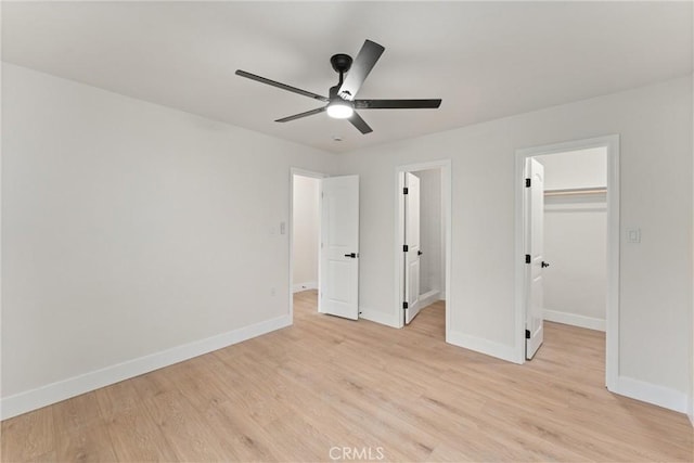 920 W Hollyvale St, Azusa, CA 91702 - unfurnished bedroom featuring baseboards, light wood-type flooring, a spacious closet, and a closet