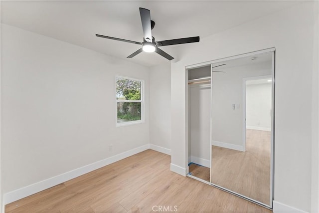 920 W Hollyvale St, Azusa, CA 91702 - unfurnished bedroom with wood finished floors, a closet, baseboards, and a ceiling fan