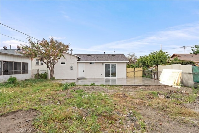 920 W Hollyvale St, Azusa, CA 91702 - back of house featuring fence, stucco siding, and a patio