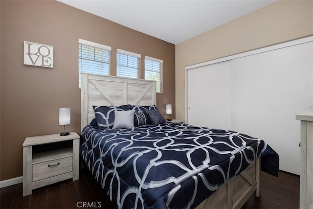 4 Mosaic, Aliso Viejo, CA 92656 - bedroom featuring a closet and dark wood-style floors