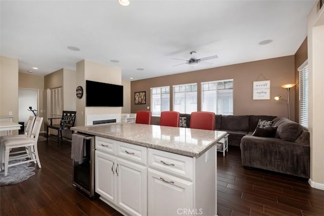 4 Mosaic, Aliso Viejo, CA 92656 - kitchen with open floor plan, a center island, dark wood finished floors, and wine cooler