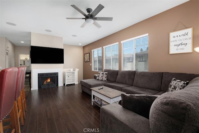4 Mosaic, Aliso Viejo, CA 92656 - living area featuring a tiled fireplace, recessed lighting, ceiling fan, and dark wood-style floors