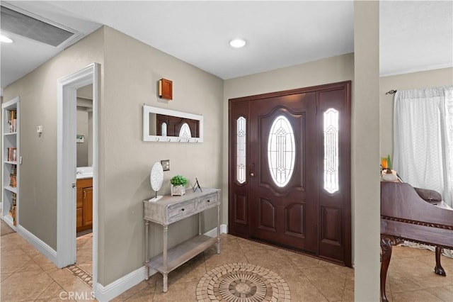 foyer entrance with baseboards, recessed lighting, light tile patterned flooring, and visible vents