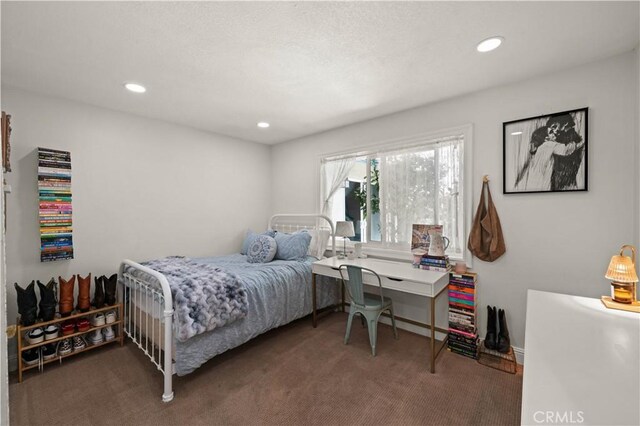 carpeted bedroom with recessed lighting