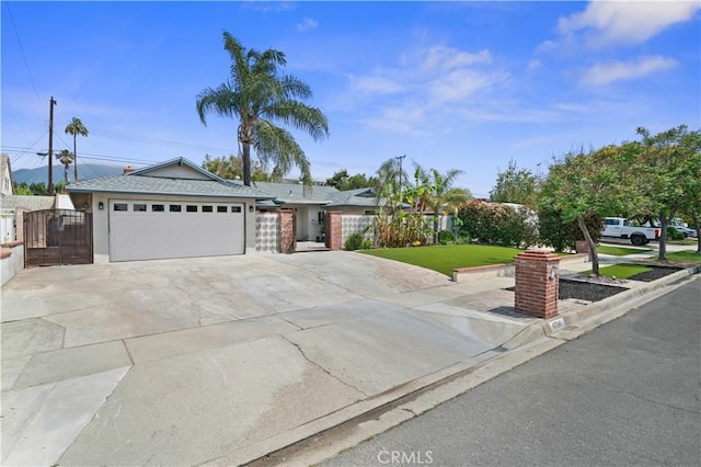 8784 Lurline St, Rancho Cucamonga, CA 91701 - ranch-style home featuring a garage, driveway, and a gate