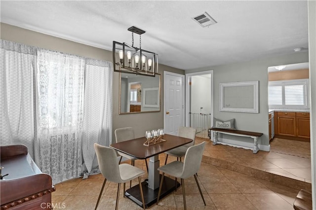 8784 Lurline St, Rancho Cucamonga, CA 91701 - dining room featuring light tile patterned flooring, a chandelier, and baseboards