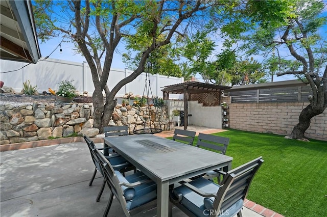 view of patio featuring a fenced backyard, a pergola, and outdoor dining area