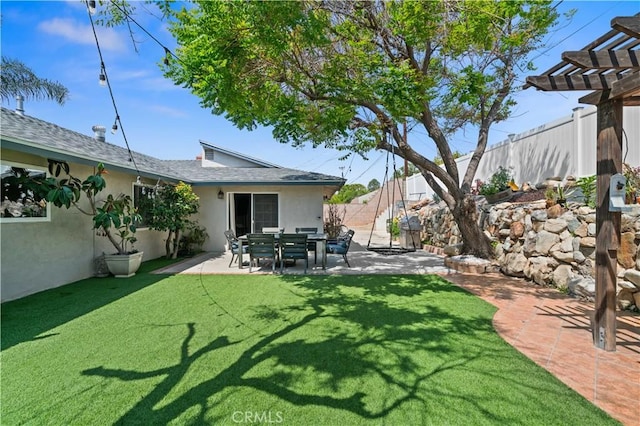 view of yard with a patio, a fenced backyard, and a pergola