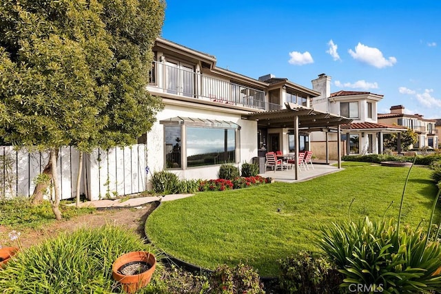 776 Avenida Salvador, San Clemente, CA 92672 - rear view of property featuring stucco siding, a chimney, a balcony, a lawn, and a patio