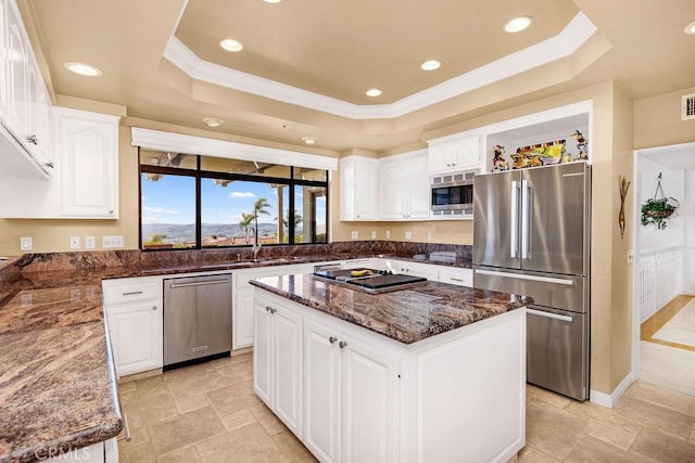 776 Avenida Salvador, San Clemente, CA 92672 - kitchen with dark stone counters, white cabinets, appliances with stainless steel finishes, and a tray ceiling