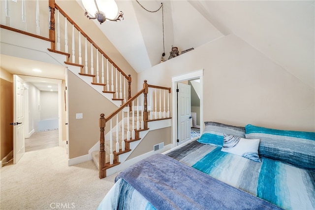 26122 Augusta Dr, Lake Arrowhead, CA 92352 - carpeted bedroom with high vaulted ceiling and baseboards