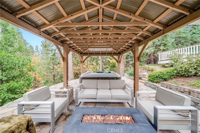 26122 Augusta Dr, Lake Arrowhead, CA 92352 - view of patio with an outdoor living space with a fire pit and a hot tub