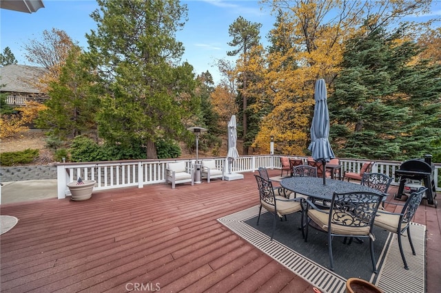26122 Augusta Dr, Lake Arrowhead, CA 92352 - deck with outdoor dining area and a grill