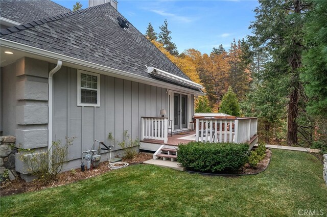26122 Augusta Dr, Lake Arrowhead, CA 92352 - exterior space featuring a yard, a wooden deck, roof with shingles, and a chimney