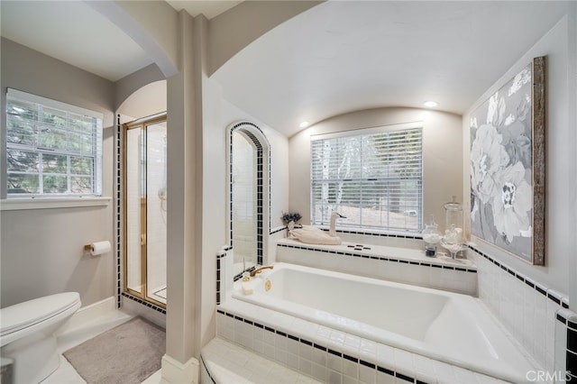 26122 Augusta Dr, Lake Arrowhead, CA 92352 - bathroom with toilet, baseboards, lofted ceiling, a garden tub, and a stall shower