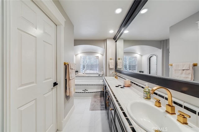 26122 Augusta Dr, Lake Arrowhead, CA 92352 - full bath featuring double vanity, recessed lighting, a sink, and a bath