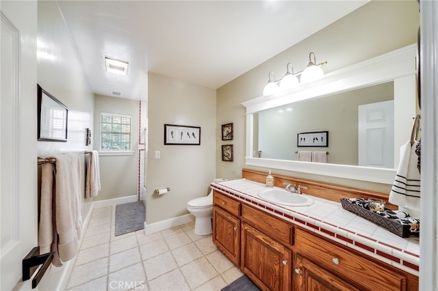 26122 Augusta Dr, Lake Arrowhead, CA 92352 - full bathroom with vanity, tile patterned flooring, baseboards, and toilet