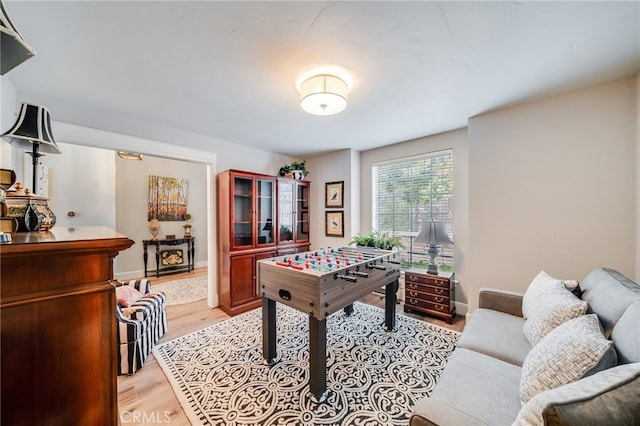 26122 Augusta Dr, Lake Arrowhead, CA 92352 - rec room with baseboards and light wood-style flooring