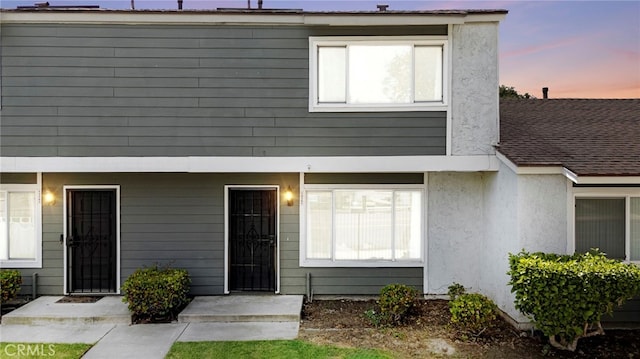 view of front of house featuring stucco siding