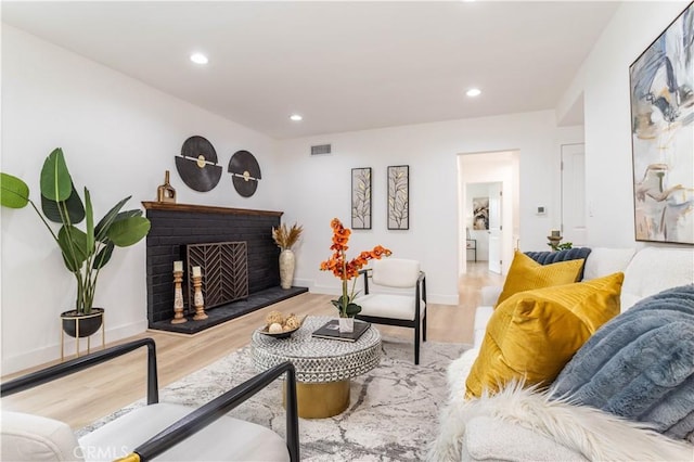 11652 Mclennan Ave, Granada Hills, CA 91344 - living area with a fireplace, recessed lighting, baseboards, wood finished floors, and visible vents