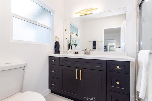 11652 Mclennan Ave, Granada Hills, CA 91344 - bathroom with vanity, a shower with door, and toilet