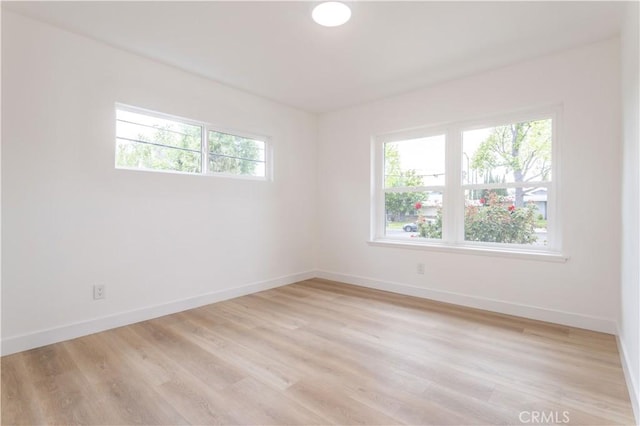 11652 Mclennan Ave, Granada Hills, CA 91344 - empty room featuring baseboards and light wood-style flooring