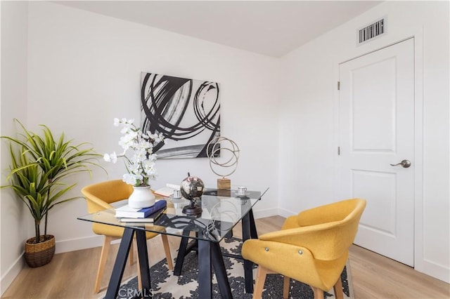 11652 Mclennan Ave, Granada Hills, CA 91344 - dining area with baseboards, light wood finished floors, and visible vents