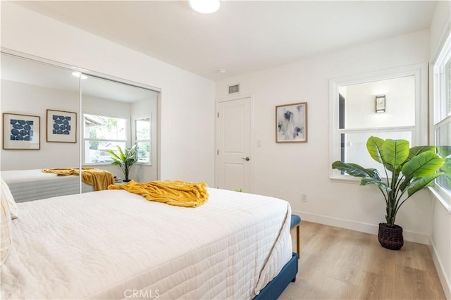 11652 Mclennan Ave, Granada Hills, CA 91344 - bedroom with a closet, baseboards, visible vents, and light wood-type flooring