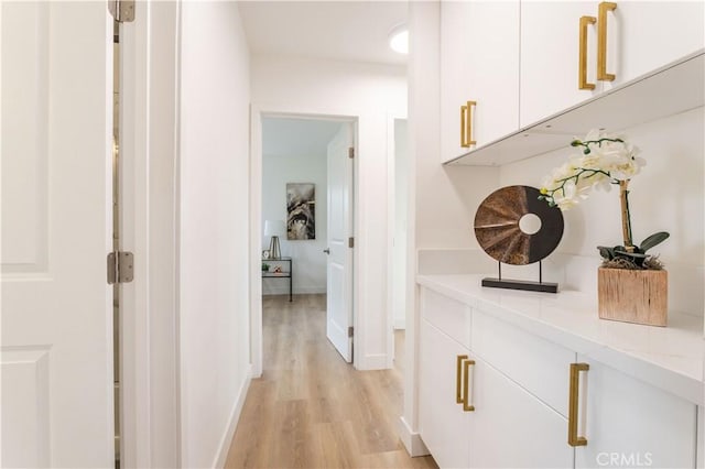 11652 Mclennan Ave, Granada Hills, CA 91344 - hallway featuring baseboards and light wood-style flooring