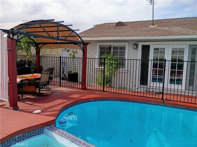 view of swimming pool with a patio, a gazebo, fence, and a fenced in pool