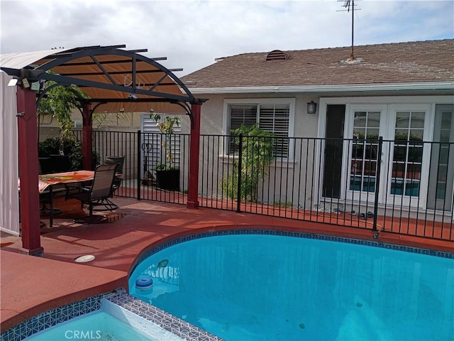 view of swimming pool with a patio, fence, a pergola, and a fenced in pool