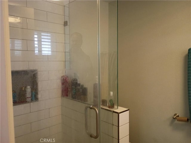 bathroom featuring a stall shower