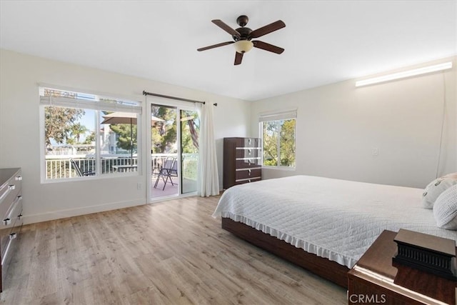 bedroom featuring ceiling fan, baseboards, access to outside, and wood finished floors
