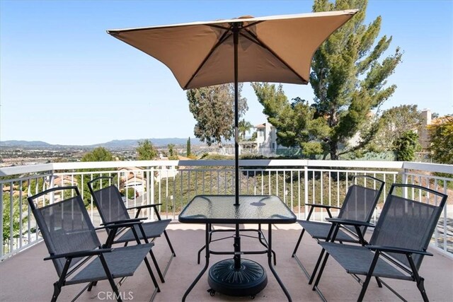 balcony featuring a mountain view