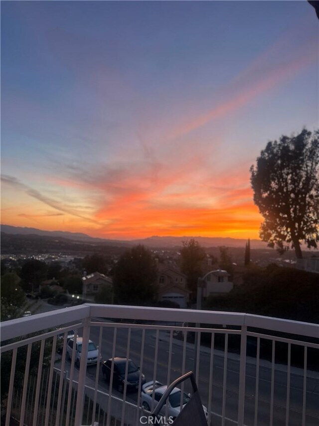 view of balcony at dusk