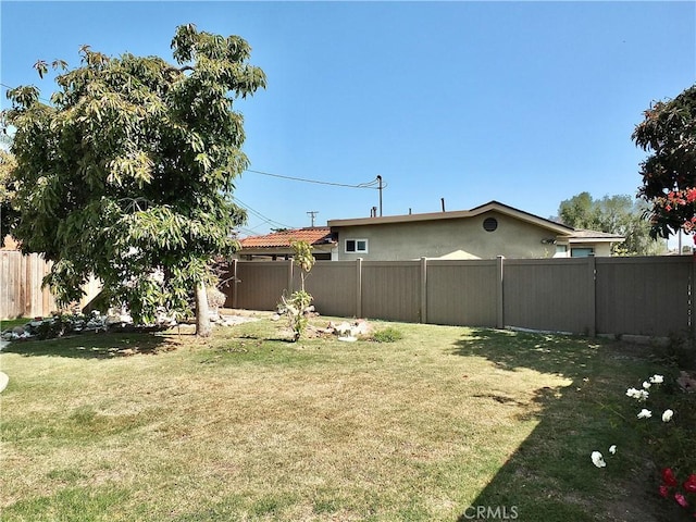 view of yard with a fenced backyard