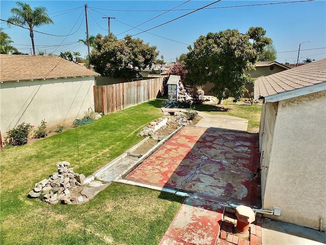 view of yard featuring a patio and fence