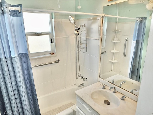 full bathroom featuring shower / bath combination with curtain and vanity